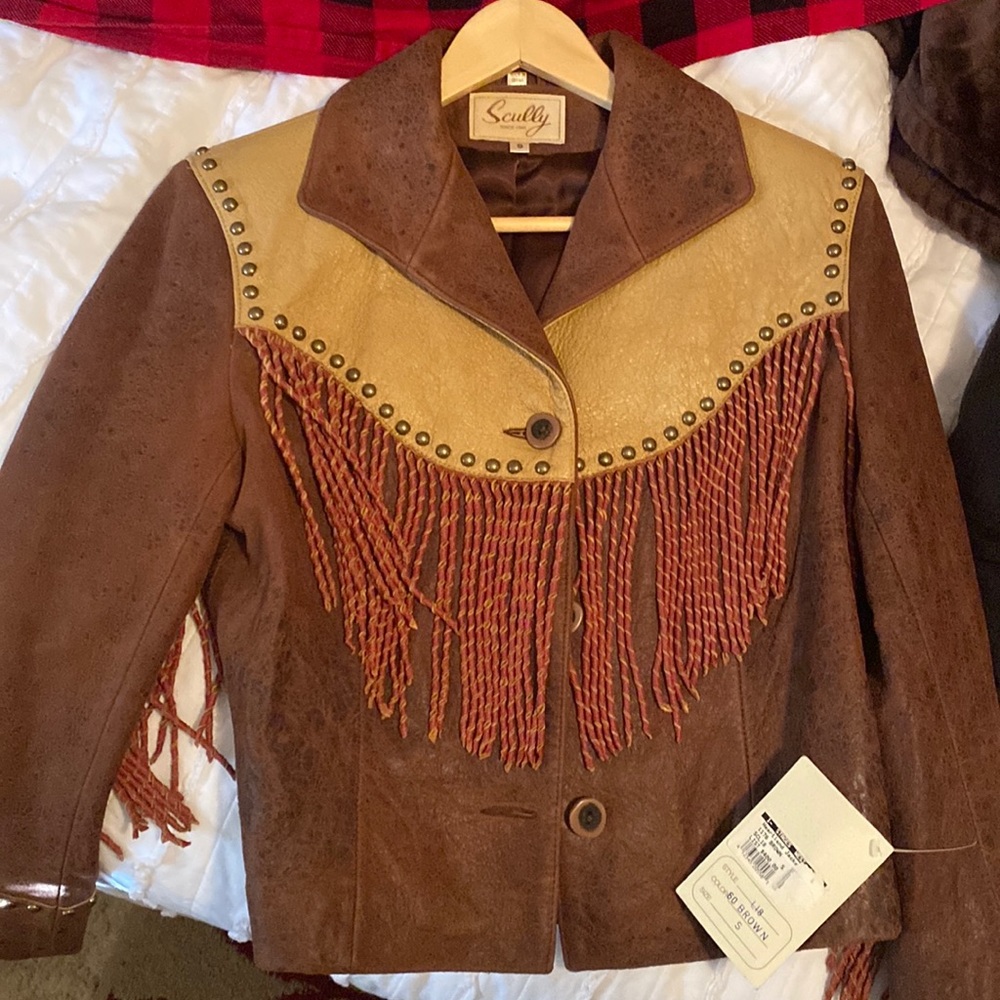 Brown fringed western leather jacket.